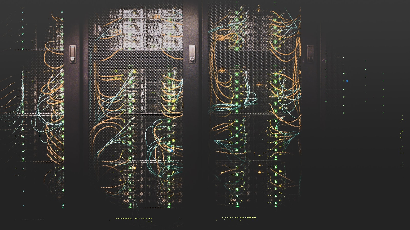 Server racks with network cabling inside a protected Hostigan data centre
